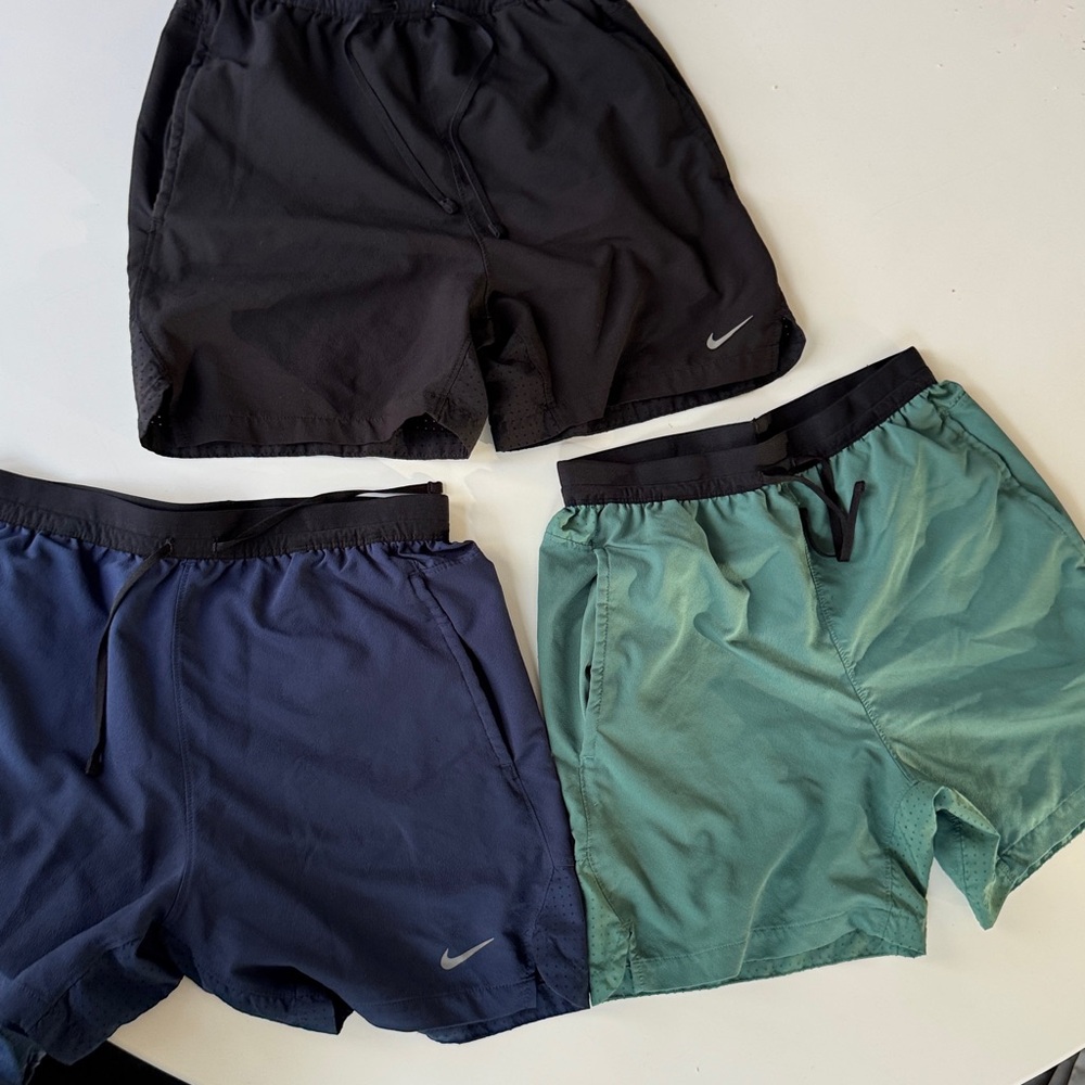 Package of Three pairs of Nike Men's Shorts Trio in Black, Navy, and Teal
